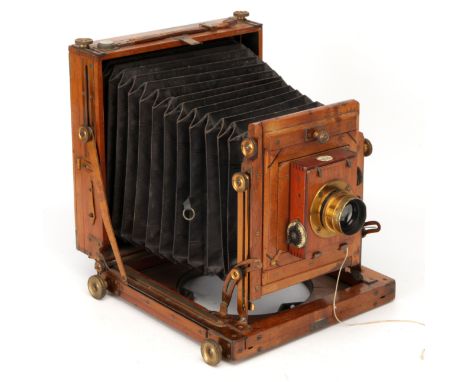 A Midland Camera Co. Half Plate Mahogany Field Camera, 1905-1911, with Taylor Taylor & Hobson Cooke Series V f/8 7.72" lens, 