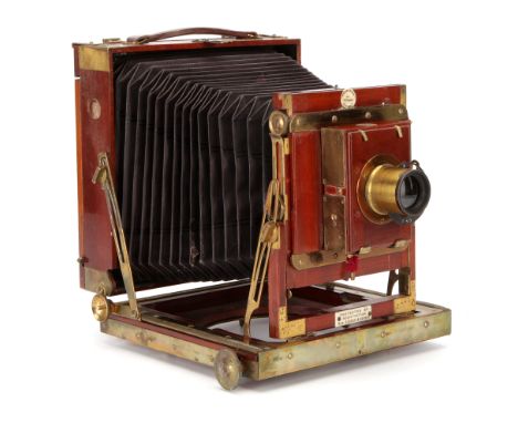 A Thornton-Pickard Royal Favourite Half Plate Mahogany Field Camera, 1909, with unmarked rotary Waterhouse stop brass lens, i