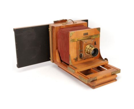 A Demaria-Lapierre Half Plate Studio Camera, with unmarked f/8 brass lens, in shutter, body, G-VG, lens, G, some light intern