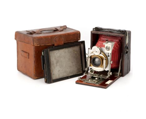 A Houghton Tudor No.5A Folding Camera, 1905-1908, with Aldis Anastigmat f/6 No.2 lens, serial no. 4202, in Bausch & Lomb shut