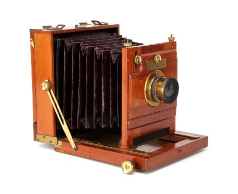 An H. Husbands Tourist Set Half Plate Mahogany Field Camera, 1886, with Ensign Symmetrical f/8 brass lens, body, VG, lens, G,