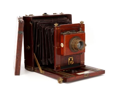 A London Stereoscopic Co. Half Plate Mahogany Field Camera, 1890-1900, with Aldis Anastigmat No.3 f/8 brass lens, in shutter,