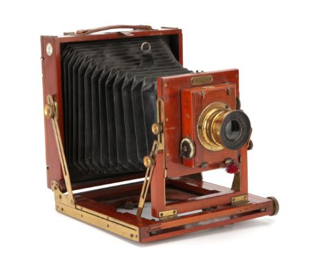 An Ensign 'The Empress' Half Plate Mahogany Field Camera, 1904-11, with Beck Symmetrical f/8 brass lens, in shutter, body, VG