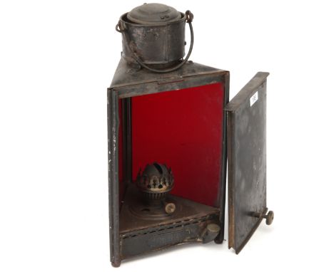 An H. Bishop & Son 'The Phoenix' Darkroom Lamp, 1880-1890, triangular tin-plate frame, with two red glass windows, enclosing 