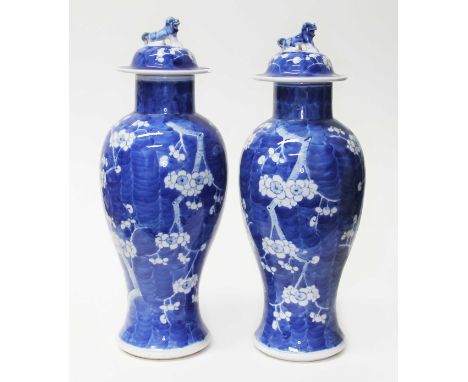 A pair of Chinese blue and white porcelain baluster vase with covers, each bearing four character Kangxi mark to base, height