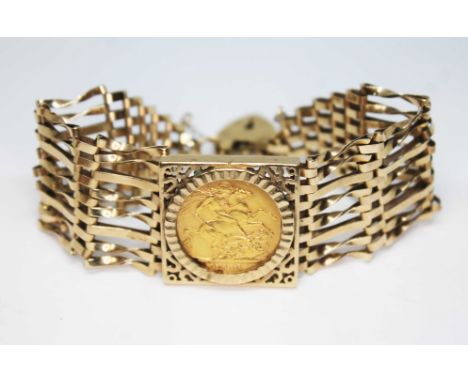 A hallmarked 9ct gold gate bracelet set with a George V 1913 sovereign, gross wt. 28.4g.  