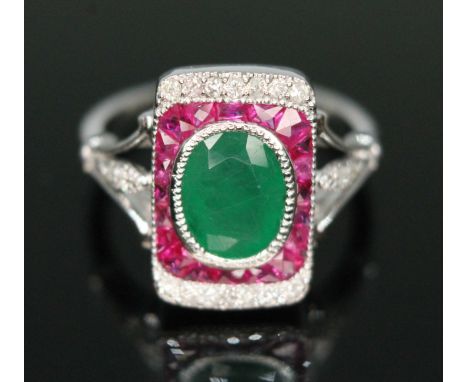 An Art Deco style diamond, ruby and emerald cluster ring, rectangular cluster measuring approx. 14.60mm x 9.65mm, band marked