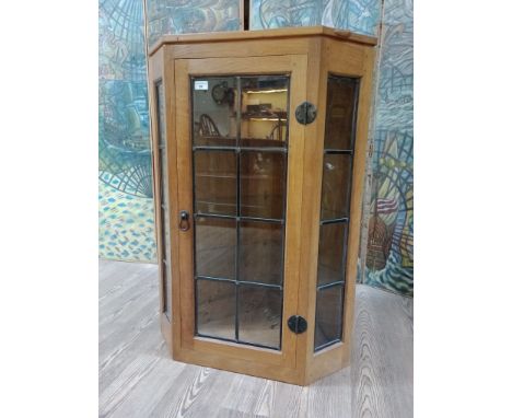 Robert 'Mouseman' Thompson of Kilburn oak and leaded glass corner cabinet with signature carved mouse detail to the top right