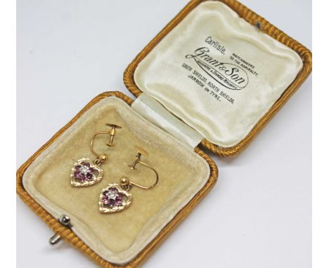 A pair of ruby and diamond heart shaped drop earrings, screw fittings, marked '9ct', gross wt. 2.3g.  