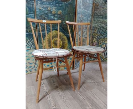 A pair of Ercol light beech and elm 'All Purpose Chairs' model 391.  