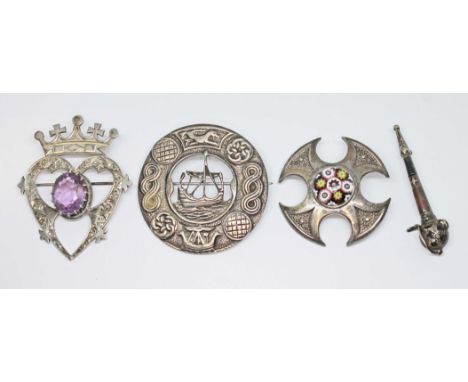 Three Scottish hallmarked silver brooches comprising a luckenbooth "Iona" silver brooch set with an oval cut amethyst by John