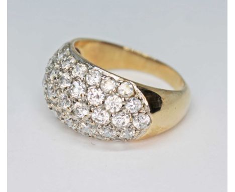 A hallmarked 9ct gold ring set with colourless stones, gross wt. 8.2g, size R/S.  