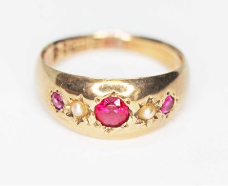 A late Victorian ruby and pearl ring, Chester 1900, gross wt. 3.3g, size L/M.  Condition - band currently split, otherwise ok