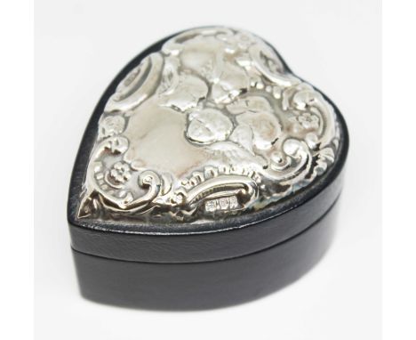 A silver topped heart shaped leather ring or trinket box, embossed with cherubs amongst clouds, Keyford Frames Ltd, London 19