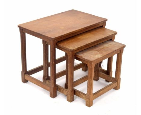 Robert 'Mouseman' Thompson - nest of three rectangular oak side tables, on typical hexagonal supports, largest 24" wide, 15" 