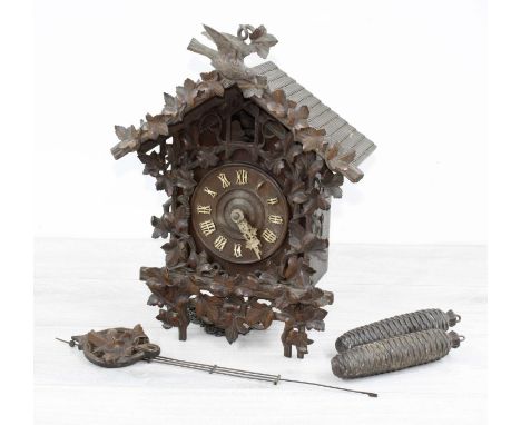 Black Forest carved cuckoo clock (pendulum and two weights) 16" high 