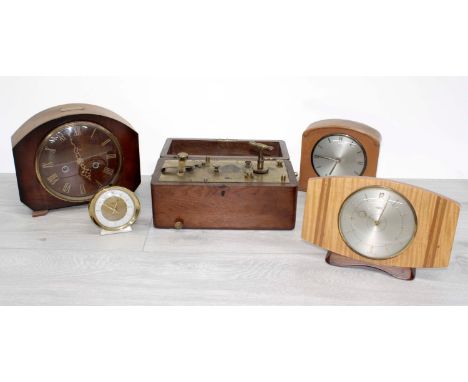Three vintage mantel clocks, two by Smiths and one Metamec; together with a 'Baby Ben' travel clock and another piece of cloc