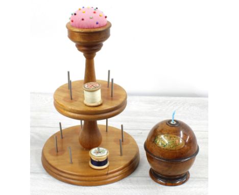 Treen ball wool winder, 4" high; together with a tiered cotton reel holder with pin cushion, 11" high (2) 