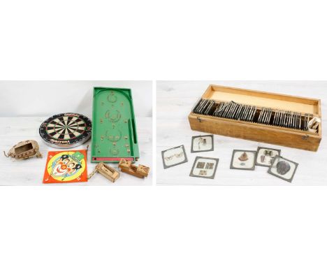 Vintage bagatelle board, Winmau dart board, vintage clown ring toss, small collection of anatomical slides, souvenir puzzle b