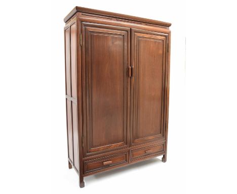 Chinese hardwood cupboard, with two panelled doors enclosing shelved interior, over two short drawers 37.5" high 15" deep 56"
