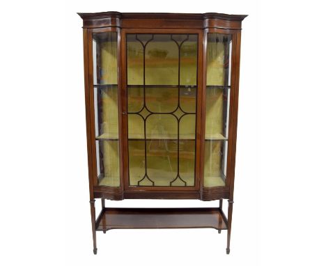 Edwardian mahogany inlaid display cabinet, with a central astragal glazed door flanked by bowed glazed panels enclosing a fab