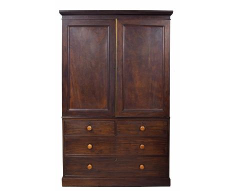 19th century mahogany linen press, with double panelled doors over two short and two graduated long drawers upon a plinth bas