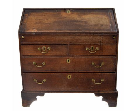 Early 18th century oak bureau, the crossbanded fall front enclosing a fitted interior with a sliding well compartment, over t