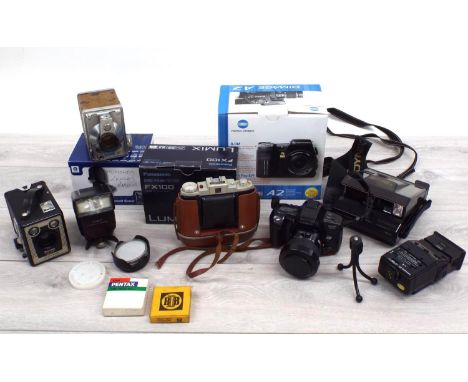 Collection of cameras and accessories; including Konica Minolta Dimage A2, Panasonic FX100 Lumix Polaroid, Kodak Brownie etc;