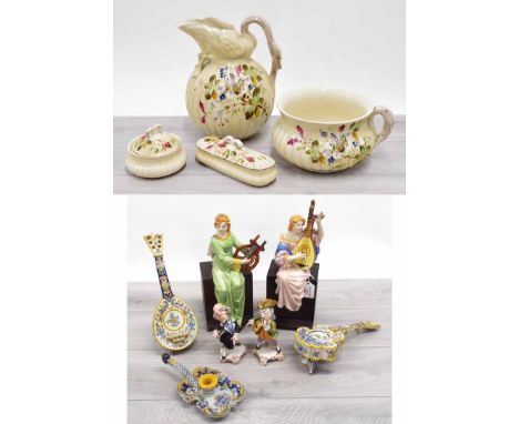 Potter jug and wash basin set with soap dishes and chamber pot; Pair of Continental pottery figures, modelled with seated lad