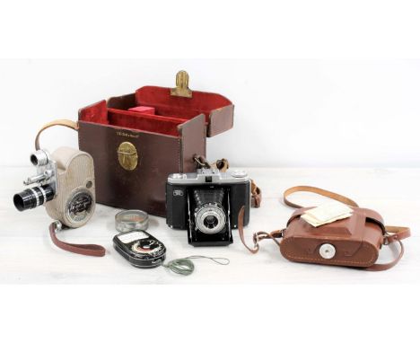 G.B -Bell &amp; Howell model 605 camera, in a fitted leather carry case; together with a Zeiss Ikon Nettar camera (2) 