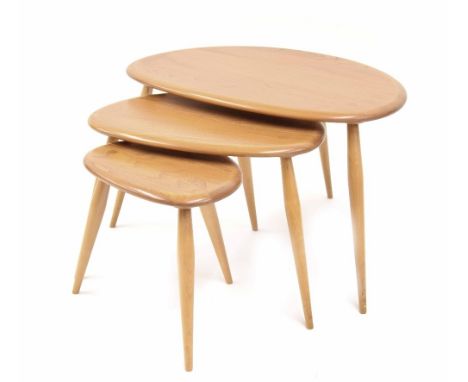 Nest of three Ercol beech and elm 'Pebble' side tables, largest 26" wide, 17.5" deep, 16" high 