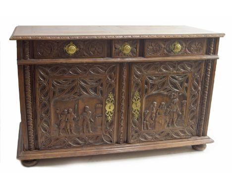 Large antique Continental carved oak sideboard, the rectangular top over three short drawers and carved panelled cupboard doo