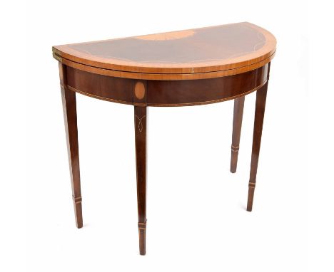 Sheraton style mahogany and satinwood inlaid demi lune foldover card table, the top with a paterae and satinwood crossbanded 