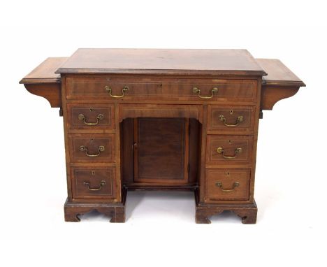 19th century mahogany kneehole desk, the moulded top with unusual drop-flap extensions, over single long drawer and six short