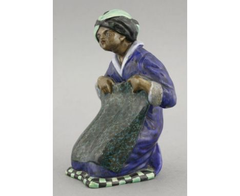 A Royal Doulton 'Carpet Vendor' figure,modelled by Charles J Noke, HN350, inscribed and numbered 163,15cm high