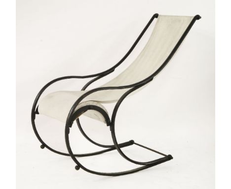 A R W Winfield type rocking chair,20th century, with a plain linen seat