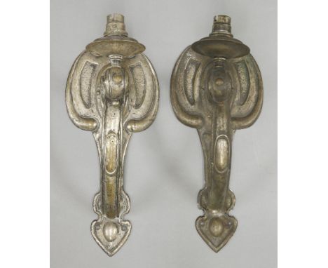 A pair of silver-plated brass wall lights,each with a single light on a scrolled arm,32.5cm high (2)