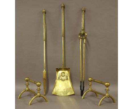 A set of three Arts and Crafts brass fire tools, by Benham & Froud, the shovel embossed with a flower,58.5cm long, anda pair 