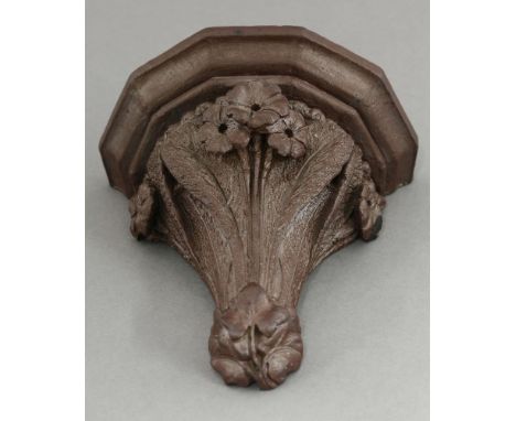 R W Martin & Brothers stoneware wall bracket, the bracket modelled as bunches of primroses and leaves, incised 'Clay from Plu