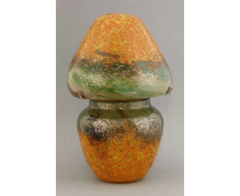 A Monart glass table lamp,the shade and base in mottled green and orange with gold aventurine inclusions, wood and brass ligh