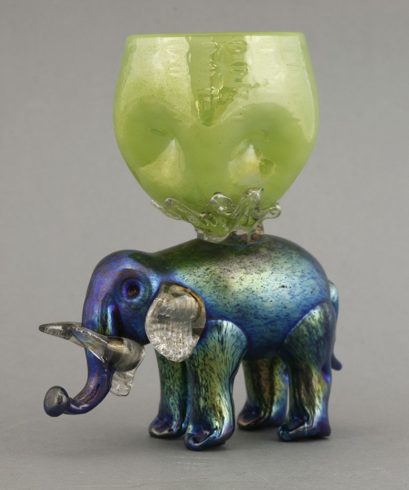 A rare Loetz iridescent elephant vase,the elephant with clear glass jaw, ears and tusks, the vase