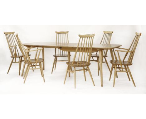 An Ercol table,with two extra hinged leaves,226cm extended84cm wide71cm high, andfour elbow chairs and two single chairs (7)