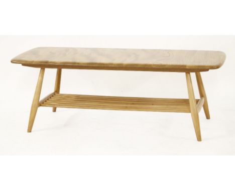 An Ercol coffee table,the shaped rectangular top over a slatted undertier, 104cm long46cm wide36cm high