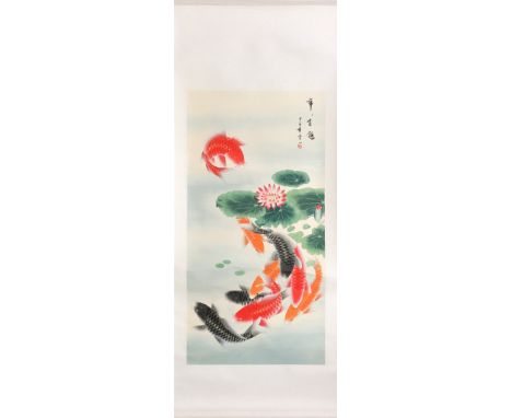 A Chinese hand painted silk mounted scroll of Carp among lotus, 56 x 135cm.