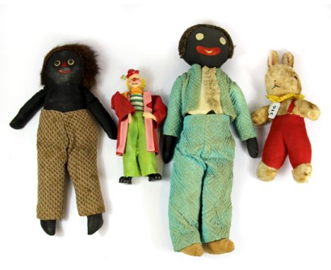 A vintage musical rabbit toy, two Gollies and a clown.