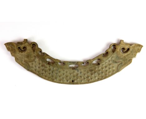 A Chinese archaic form jade/ hardstone dragon, W. 15cm.