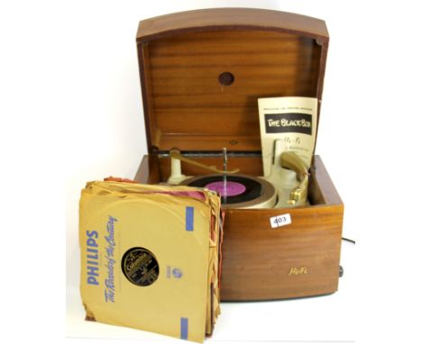 A vintage mahogany veneered record player and quantity of 78 RPM records.