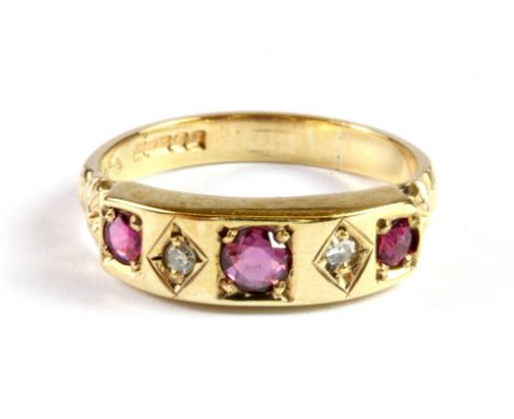 A 9ct yellow gold ruby and diamond set ring, (N).