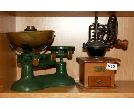 A vintage kitchen scale and coffee grinder.