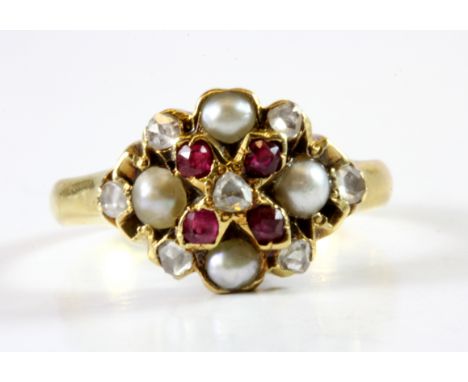 An antique 18ct yellow gold ring set with ruby, diamonds and seed pearls, (N).